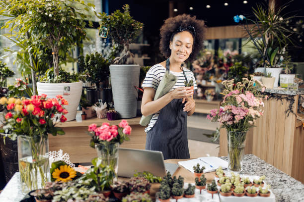 istock Young florist enjoying at her workplace 1298856142