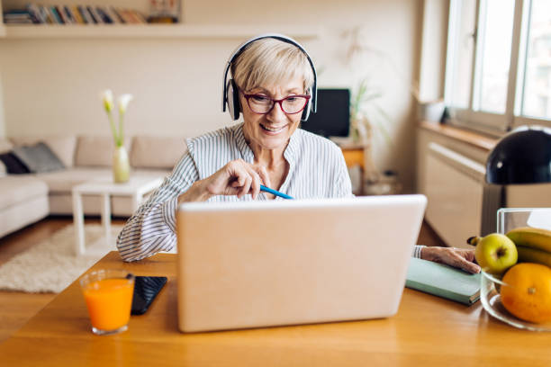 istock Mature woman freelancing from home office 1298856837