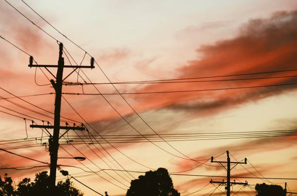 istock Red sunset over telegraph poles 1298857210