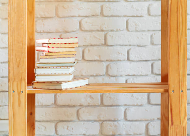 istock Wooden rack shelf with home decor stuff 1298858554