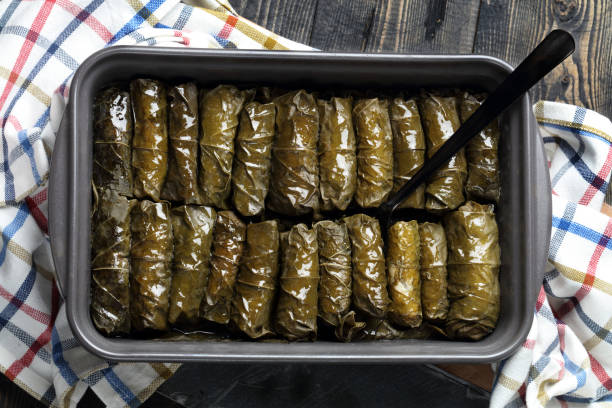 istock Traditional Oriental dolmades - stuffed grape leaves baked in ceramic form 1298858613