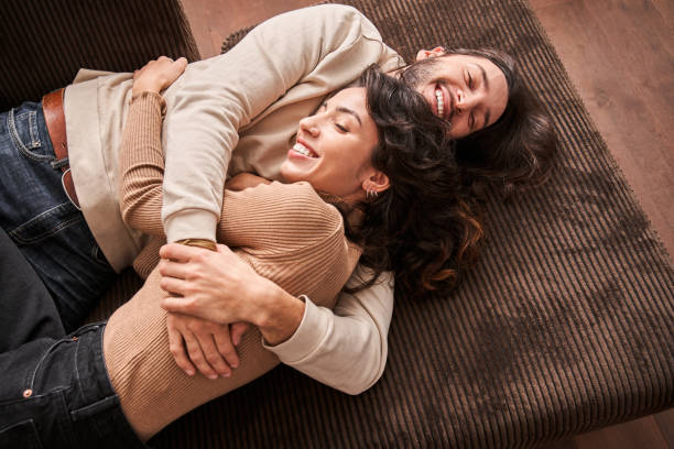istock Lovely spouses bonding to each other and smiling 1298859779