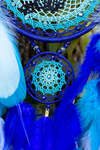 istock Handmade dream catcher with feathers threads and beads rope hanging 1298862215