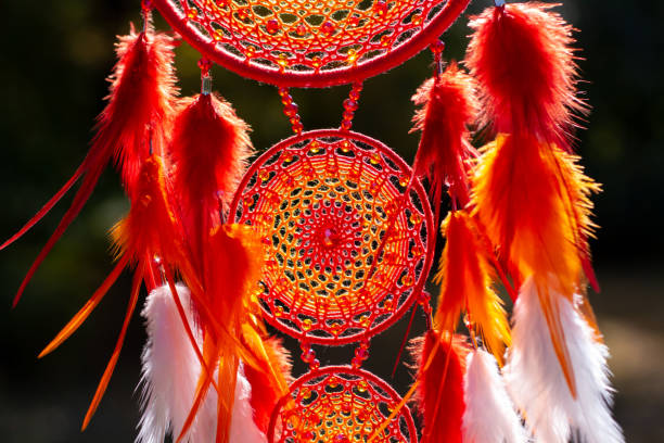 istock Handmade dream catcher with feathers threads and beads rope hanging 1298862221