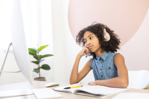 istock An African schoolgirl is learning online 1298863569