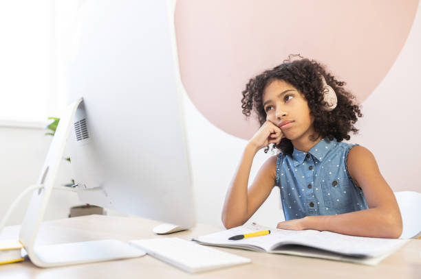 istock An African schoolgirl is learning online 1298863585