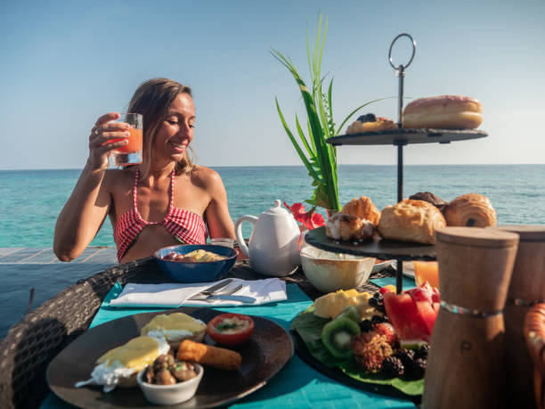istock Woman enjoying floating breakfast in luxury hotel 1298863688