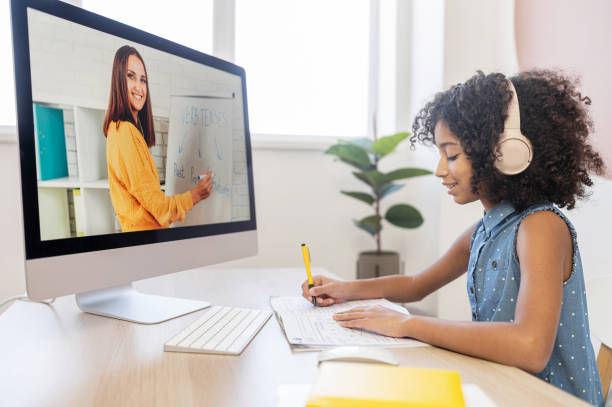 istock An African schoolgirl is learning online 1298863703