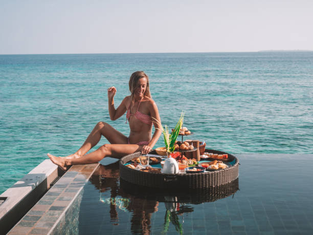 istock Woman enjoying floating breakfast in luxury hotel 1298863764