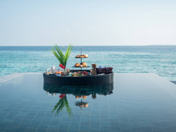 Floating breakfast on infinity pool in luxury hotel