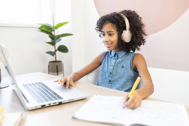 istock An African schoolgirl is learning online 1298863876