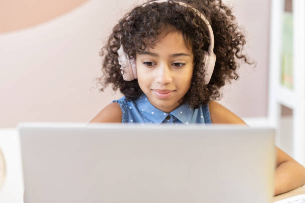 istock An African schoolgirl is learning online 1298863979