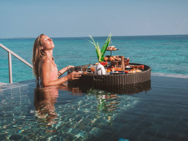 istock Woman enjoying floating breakfast in luxury hotel 1298864111