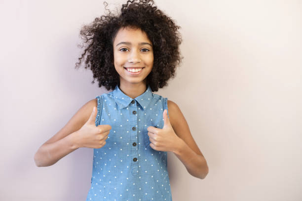 istock A nice African-American girl on pink 1298864373