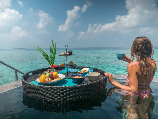 istock Woman enjoying floating breakfast in luxury hotel 1298865293