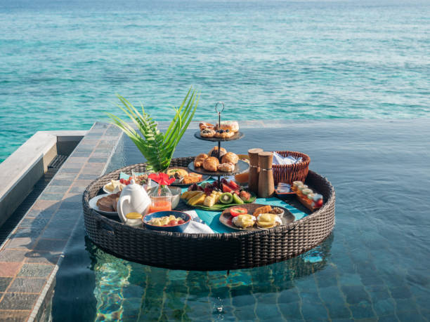 istock Floating breakfast on infinity pool in luxury hotel 1298865296