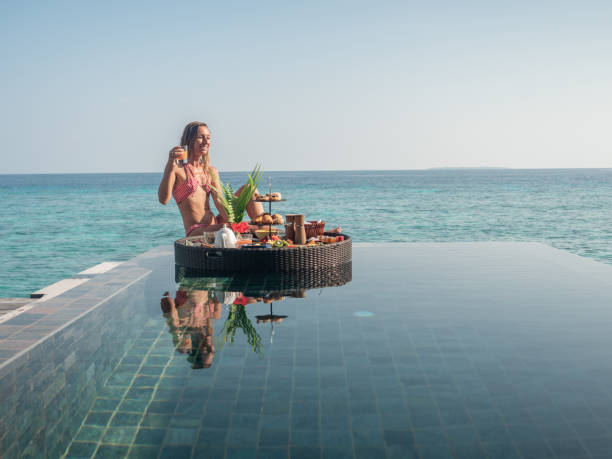 istock Woman enjoying floating breakfast in luxury hotel 1298865361