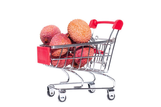istock Pile of fresh ripe lychees on white background 1298874263