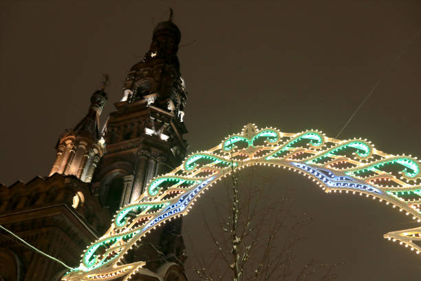Glowing arch and bell tower of cathedral on Bauman street in Kazan at night