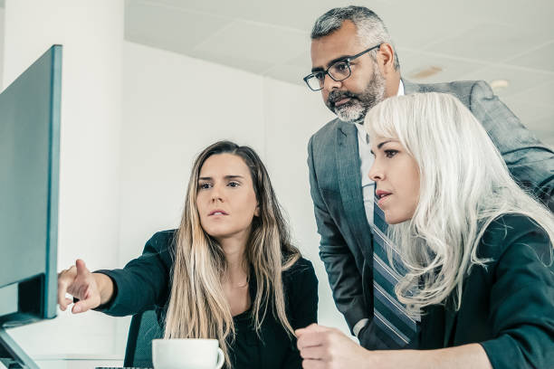istock Business group watching presentation on pc monitor 1298879470