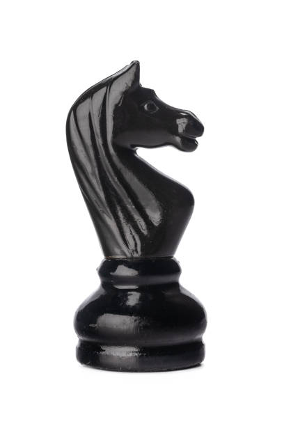 istock Black chess piece isolated on white background 1298881307