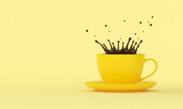 istock Yellow cup with splashes of coffee on a colored background 1298881755