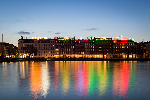 Copenhagen, Denmark - April 09, 2016: Neon light advertisement billboards on buildings at night