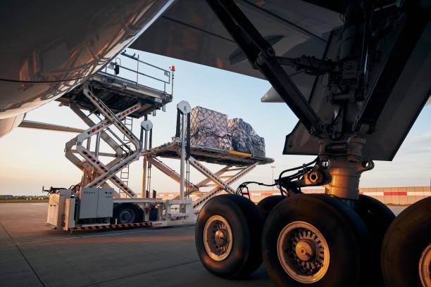 istock Loading of cargo containers to freight airplane 1298885834