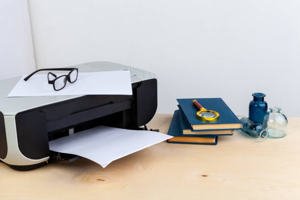 istock Office printer close up on a wooden table 1298888209