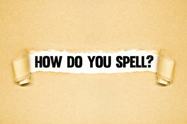 istock How do you spell? , Torn paper revealing words 1298888700
