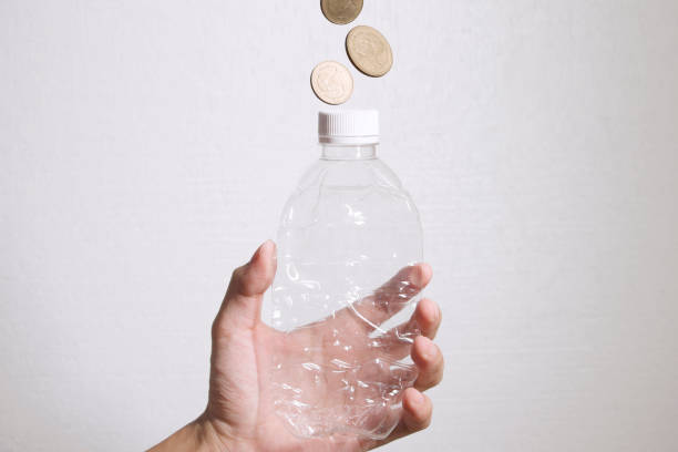 Plastic Bottle make Money. Recycle plastic bottle to money stock photo