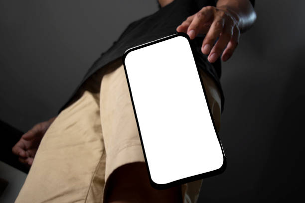 A guy drop his phone heard bad news and have a shock. white screen phone stock photo