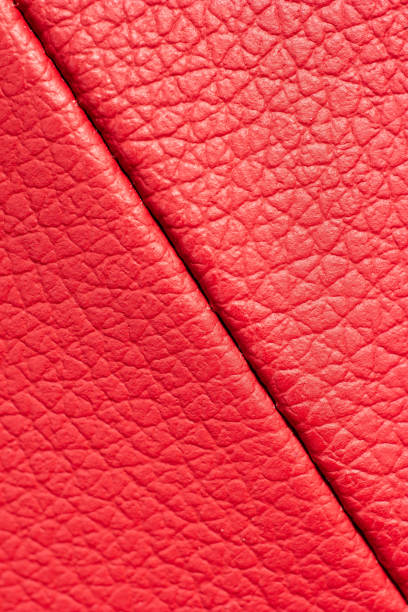 istock Red leather pattern scales texture macro close up shot front view diagonal stitched seam 1298892794