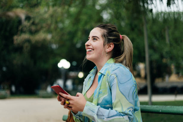 istock Smiling and connected in the public park 1298894414