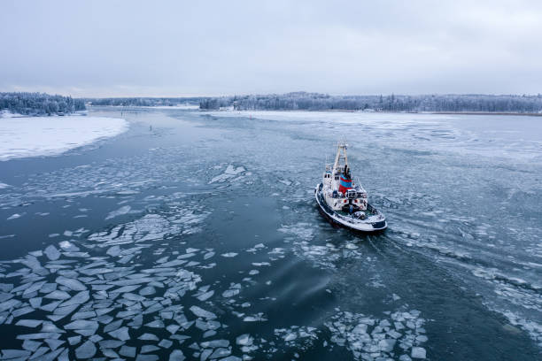 istock Tug boat pushing through the ice 1298894868
