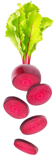 istock Isolated flying beetroots. Falling sliced beetroot with leaves isolated on white background, with clipping path 1298895377