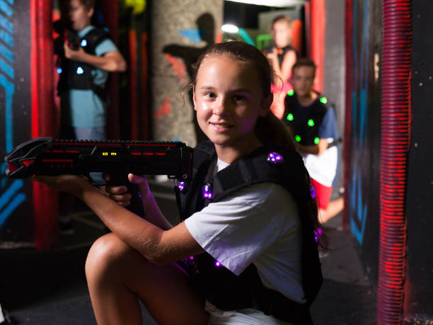 istock Girl playing laser tag 1298897205