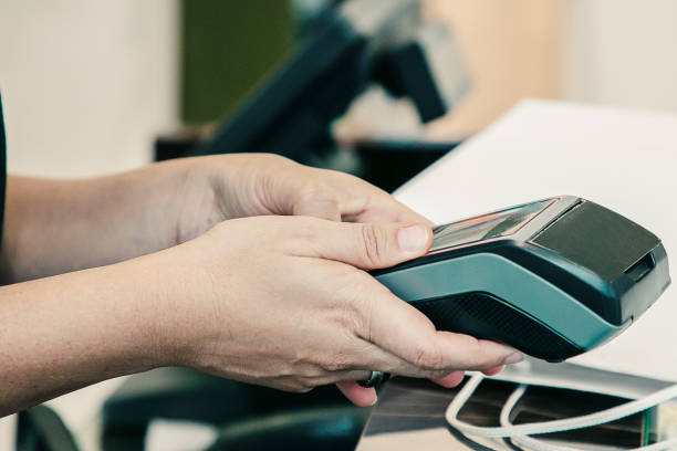 istock Cashier or seller operating payment process 1298898648