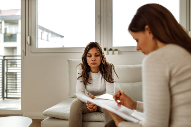 istock Woman visiting psychologist, window in the background. 1298899078