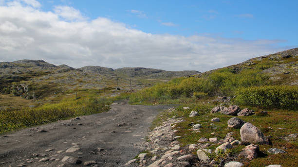 istock A country road in the mountains. 1298899429