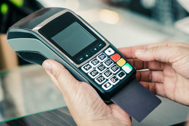 istock Clothes store cashier operating payment process 1298900293