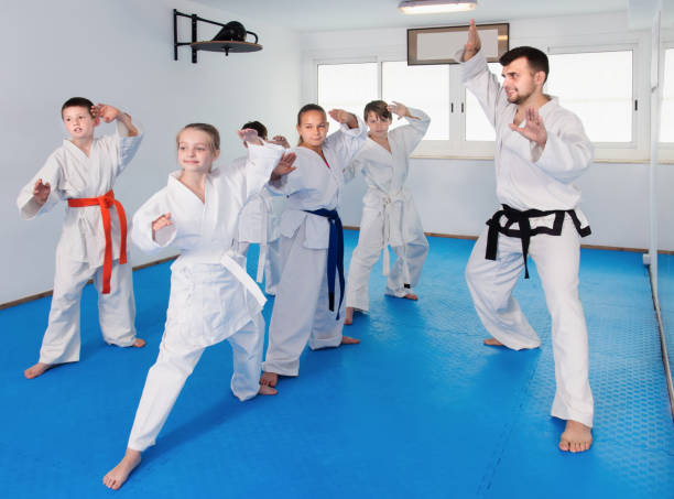istock Boys and girls training a new moves with master 1298901125