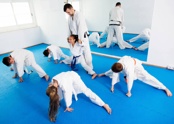 istock Children getting ready and stretching for karate 1298901129