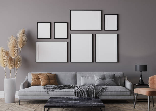 Modern living room interior, gray sofa on dark wall, gallery wall mockup Modern living room interior, gray sofa and orange chair on dark wall, gallery wall mockup artists canvas photos stock pictures, royalty-free photos & images