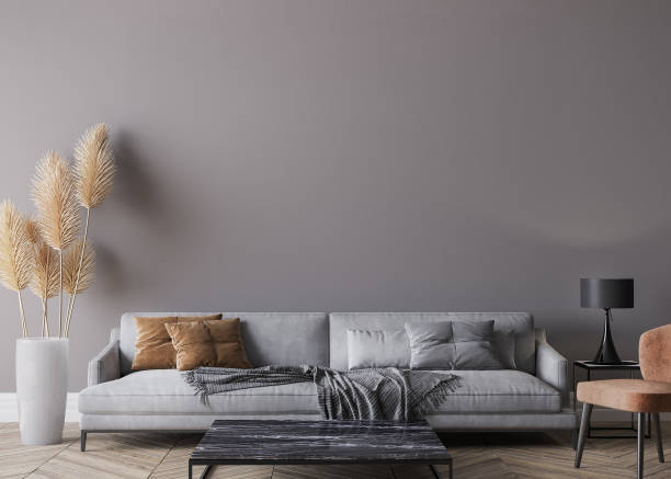 istock Modern living room interior, gray sofa on dark wall, empty wall mockup 1298901877