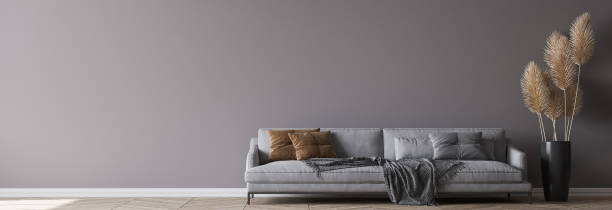istock Modern living room interior, gray sofa on dark wall, empty wall mockup 1298901910