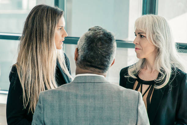 istock Female managers talking to male boss 1298903170