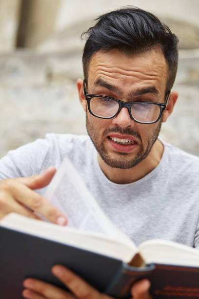istock A man sits and emotionally reads a book 1298904167