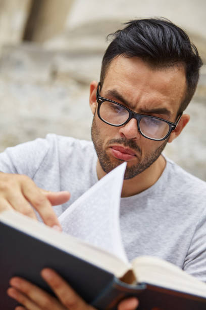 istock A man sits and emotionally reads a book 1298904206