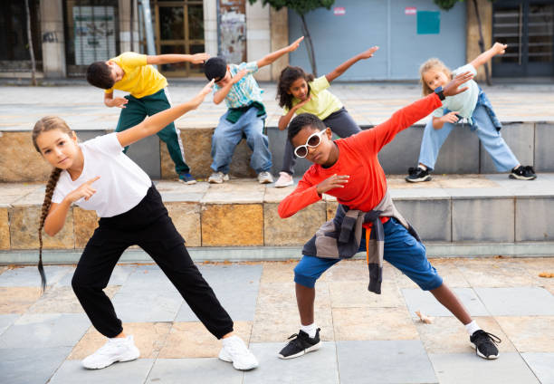istock Modern tweenagers performing street dance choreography 1298904674